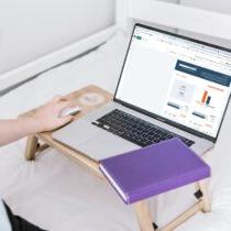 photo of a woman working on a budget on a laptop