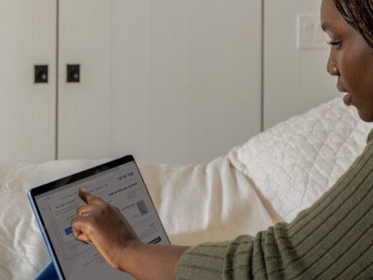 photo of woman working on a tablet